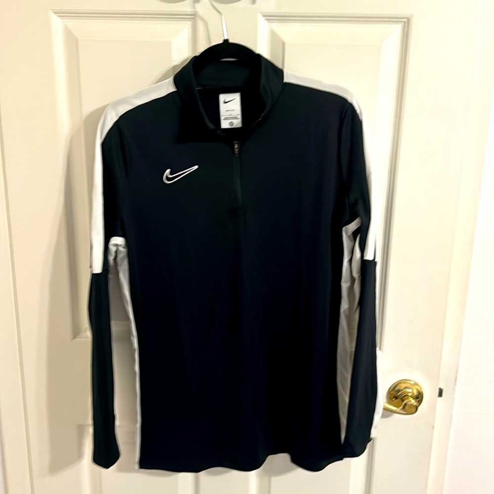 NWT Nike women’s dri fit black long sleeved top. Size large.